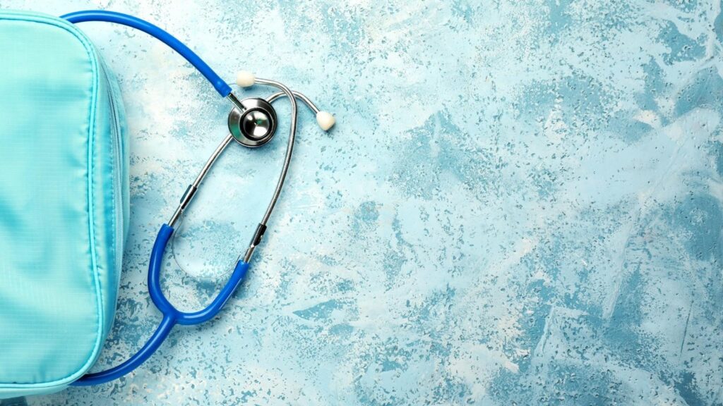 Essential items laid out for a nurse bag or nursing work bag