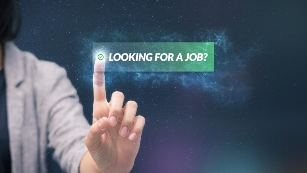 Finger pressing "looking for a job?" button in a job portal.