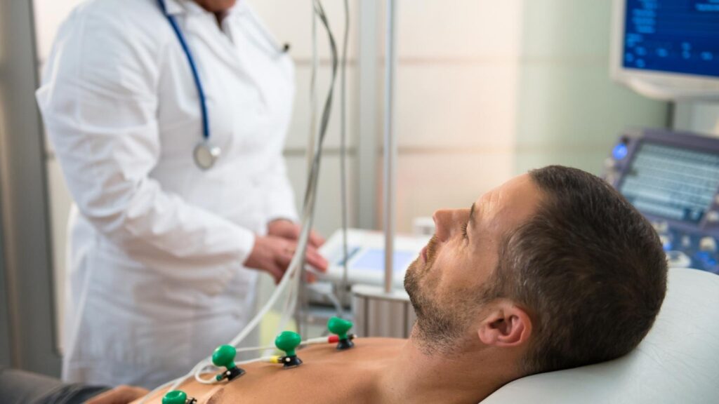 Telemetry nurse assessing the health of a man.
