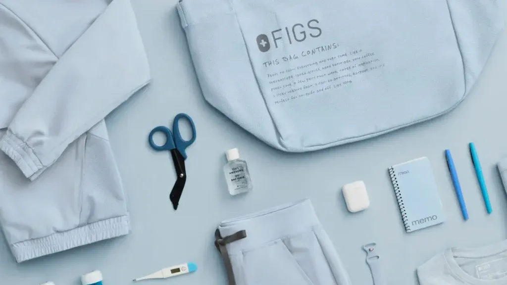 Female nurse wearing FIGS scrubs during hospital shift. Find FIGS scrubs near me.