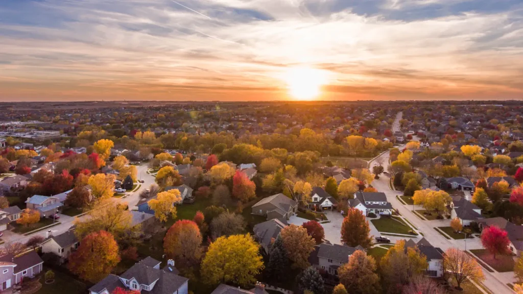 Sunset overhead skyline view of a neighborhood full of trees and travel nurse housing in Oklahoma.