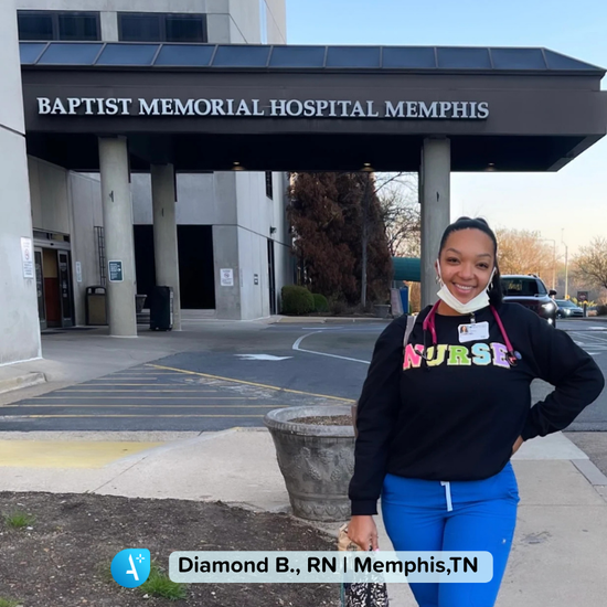Travel nurse standing outside a hospital in Tennessee, ready to begin a new assignment. The hospital entrance and signage are visible in the background, capturing the start of a travel nursing job in Tennessee.