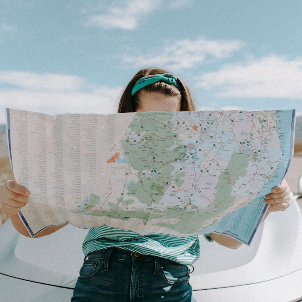 Travel physical therapist studying a road map before an assignment